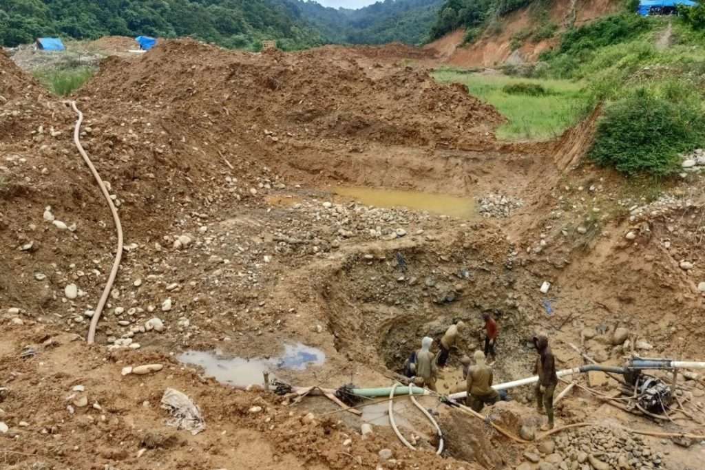 Artisanal gold extraction in Sumatra — operators dredge milky riverbeds with minimal permits or oversight.
