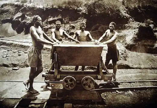 Workers hauling ore in early 20th-century Belgian Congo - a haunting echo of today’s extraction fronts.